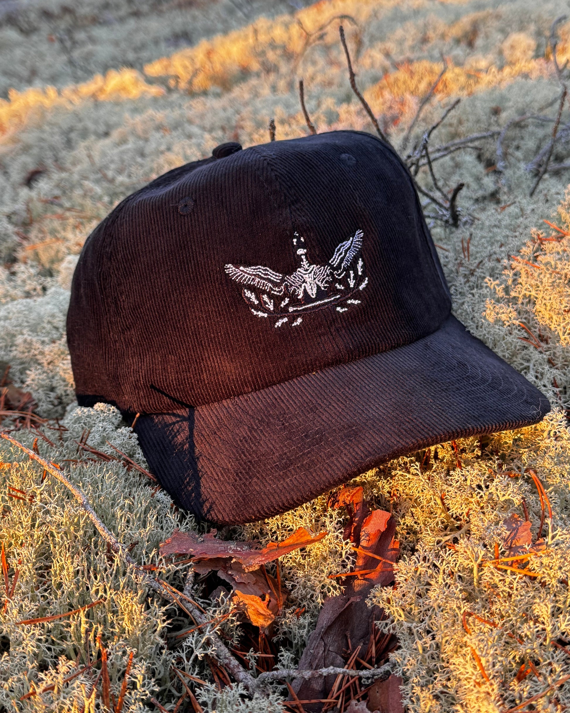 kuika black loon embroidered soft black velvet cap print n stuff closeup designed in Turku Finland
