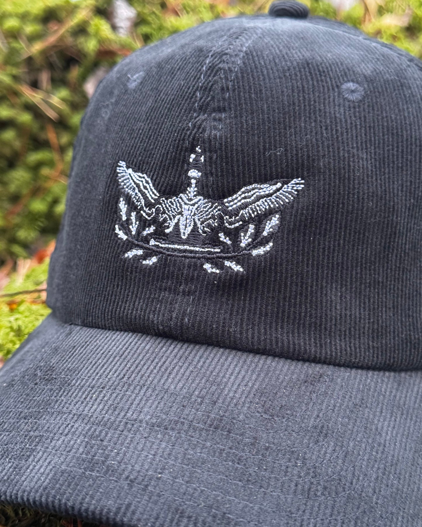 kuikka embroidered soft black velvet cap print n stuff closeup designed in Turku Finland black loon